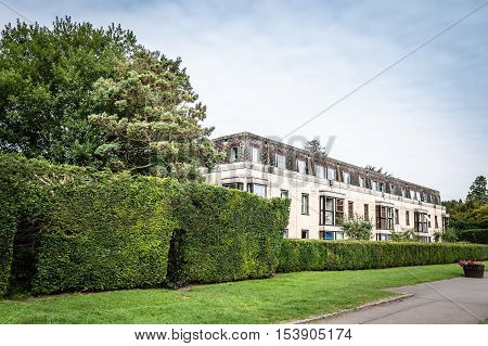 Cirencester UK - August 17 2015: Residential building in the park of Cirencester a blue sky day