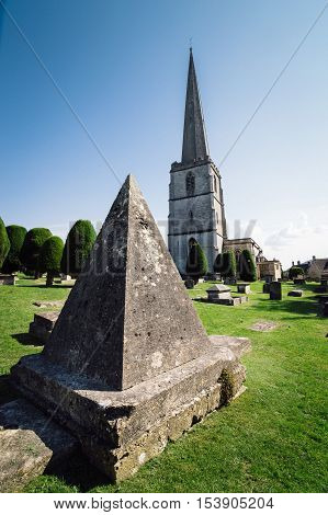 Painswick UK - August 17 2015: Pyramidal tomb in the churchyard of St Mary's Church. Painswick is a town in the Cotswolds originally the town grew on the wool trade.