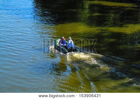 The concept of Love for all ages. Romantic love - in this world there are only we and nobody else. Romantic date on an inflatable boat