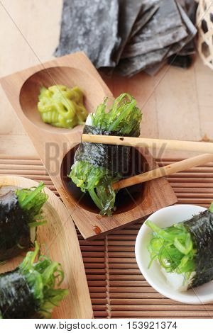 Sushi roll and seaweed salad is delicious