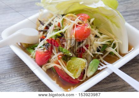 Thai vegetable salad (Som tum) on foam plate