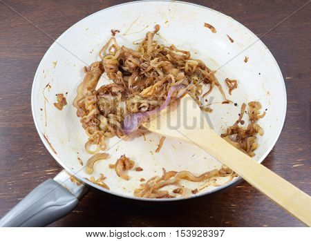 Wooden Spatula Stirring Caramelized Onions