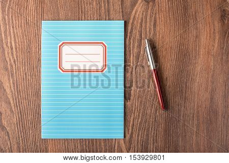 Colored Exercise Book On The Wooden Table