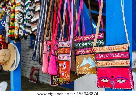 Photo of colorful small bags in nepalese souvenir shop