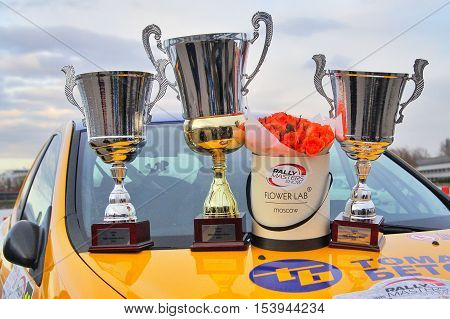 Moscow Russia - Apr 18 2015: Trophy cups and flowers stand on the hood of the Subaru Impreza after the Rally Masters Show 2015 at the Krylatskoye District.