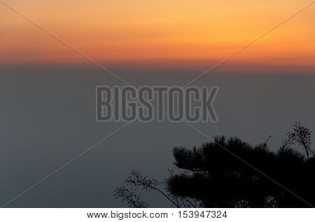 The sun rising over the Taishan Mountain range in Shandong province China.