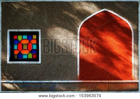 The wall of the old town with colored drawings. Iran. Persia.