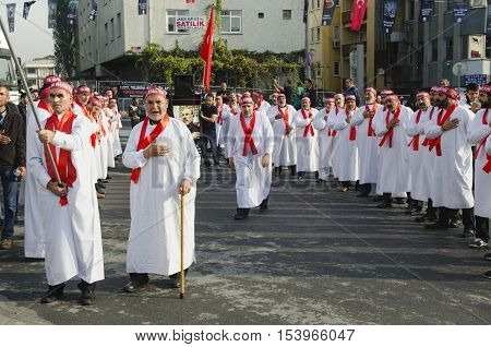 Istanbul Turkey - October 11 2016: Turkish Shia men take part in commemorations marking the mourning period of Ashura. The participants in the memorial services wear the names of martyrs on bands around their foreheads.
