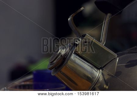 Dirt metal teapot. The metall kittele nose without steam.