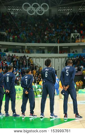 RIO DE JANEIRO, BRAZIL - AUGUST 10, 2016: Team United States during National Anthem before group A basketball match between Team USA and Australia of the Rio 2016 Olympic Games at Carioca Arena 1