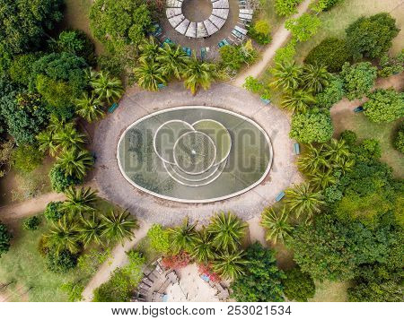 Aerial View Of Man Made Pond With Fountain In Park In Barra Da Tijuca, Rio De Janeiro. Drone Pov Sho