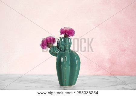 Trendy Cactus Shaped Ceramic Vase With Flowers On Table