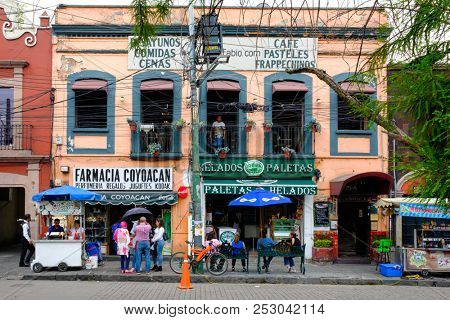 MEXICO CITY,MEXICO - DECEMBER JULY 13,2018 : Local businesses at a colorful colonial building in Coyoacan, a historic neighborhhod in Mexico City