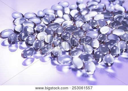 Fish Oil Supplement Capsules Isolated On White Background