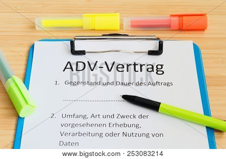 Clipboard With A Contract And Inscription In German Adv-vertrag In English Adv Contract And Subject 