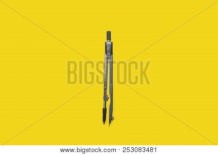 Calipers Lying On A Yellow Background . Concept Of Office Supplies. Free Space For Advertising Text