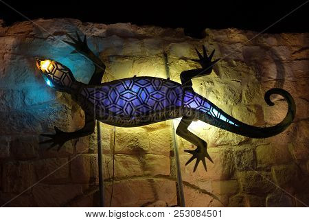 Beer Sheva, Israel - August 08, 2018: Festival Of Light In Beer Sheva 2018. Giant Lizard On The Wall