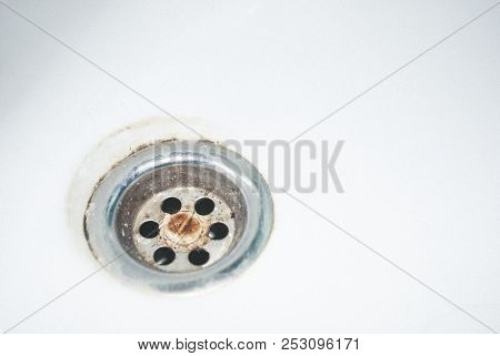 Old Used Rusty Draining Point Of Basin In Toilet