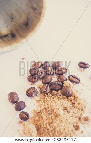 Vintage Mug Pouring Roasted Coffee Bean And Brown Sugar