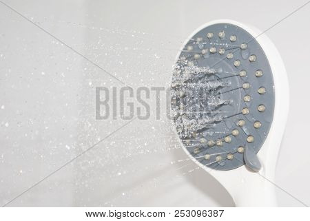Close Up Water Flowing Out From Shower In Bathroom