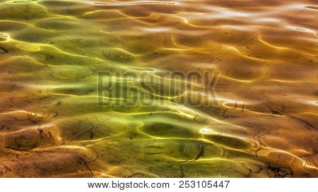 Beautiful Calm Shallow Waters In Green And Gold