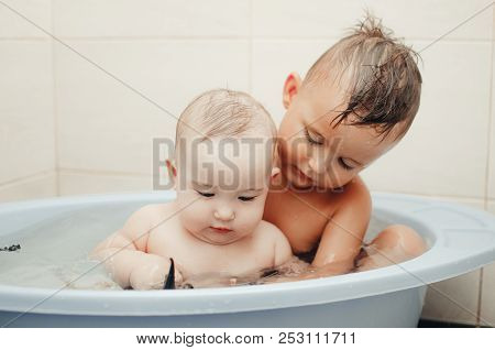 Children, Brother And Sister In The Bathroom