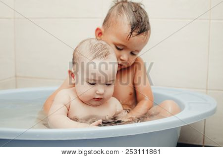 Children, Brother And Sister In The Bathroom