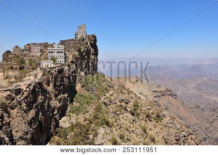 Medieval Village Of Manakhah In Jebel Haraz Mountains On Top Of Rock Against Blue Sky, Yemen