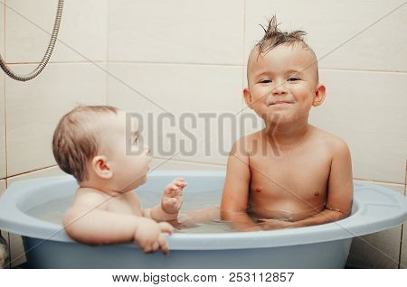 Children, Brother And Sister In The Bathroom