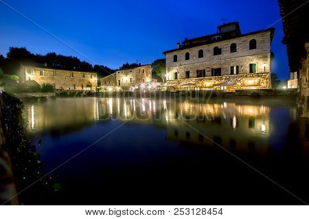 Ancient Thermal Bath In Bagno Vignoni, A Medieval Village In Tuscany, In The Evening, Italy