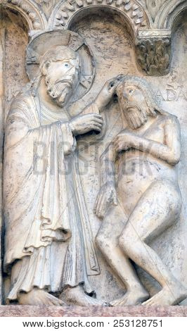 MODENA, ITALY - JUNE 04: Plate with stories from Genesis: Creation Of Adam relief by Wiligelmo, Modena Cathedral, Italy on June 04, 2017.