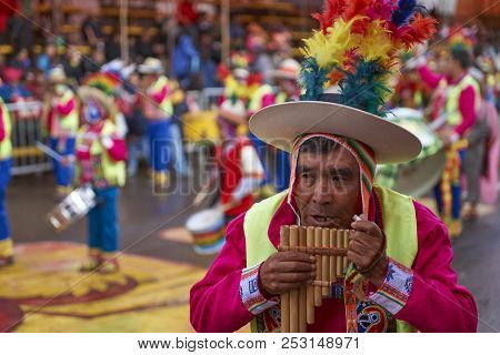 Oruro, Bolivia - February 25, 2017: Man In A Tinkus Dance Group Playing Pan Pipes At The Annual Orur