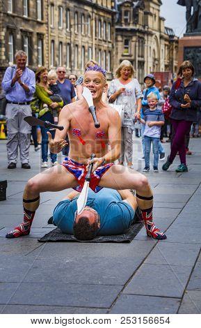 Edinburgh, Scotland  - August 7: Street Performer Spikey Will Juggling At The Edinburgh Fringe Festi