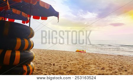 August 3, 2018:  Life Ring On The Sand And Umbrella On Beach, Beautiful Sea View Background At Cha-a