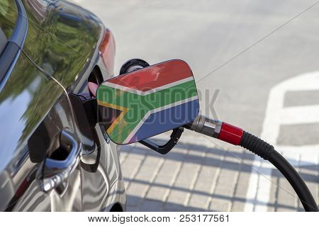 Fueling Car With Petrol Pump At A Gas Station.