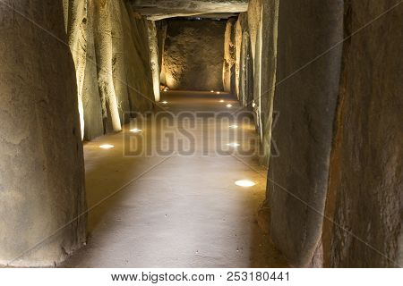 Trigueros, Spain - July 2nd, 2018: Dolmen De Soto Interior. Corridor From Entrance View, Trigueros, 