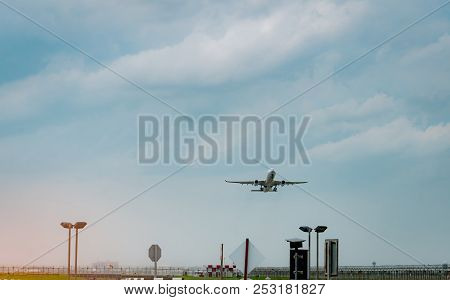 Passenger Plane Takes Off At Airport With Beautiful Blue Sky And Clouds. Leaving Flight. Start The A
