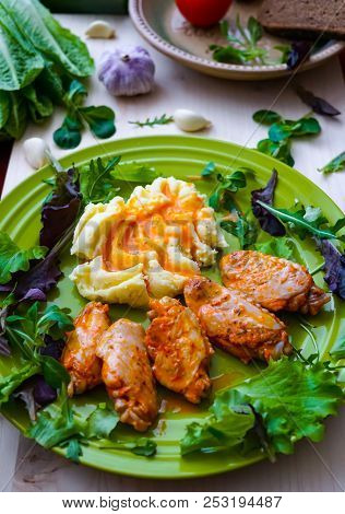 Fried Chicken Wings With Potato Puree, Sprinkled With Sweet Paprika Sauce.