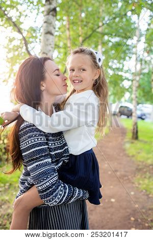 Mother Brings Her Daughter To School. Adorable Little Girl Feeling Very Excited About Going Back To 