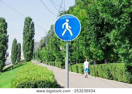 Pedestrian Area. Road Sign. Embankment In Saratov, Russia. Lonely Pedestrian In Shorts.