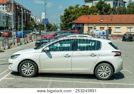 Novi Sad, Serbia. July - 31. 2018. White Citroen C4 Car Parked On The Parking Space In The City. Edi