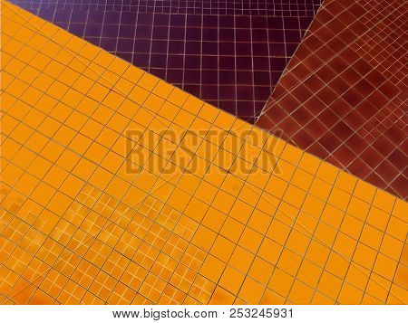 Shiny Deep Yellow, Brown And Violet Tile Wall