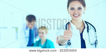 Female Doctor Shows A Sign Okay Standing In Hospital