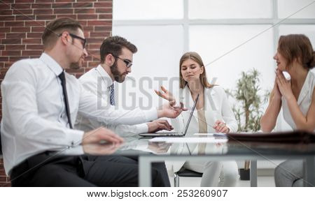 business team using laptop to get new informatio