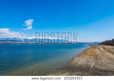 Slovakia: Small Village Near The Tatra Mountain. Liptovska Mara Lake In Foreground. Winter And Snow