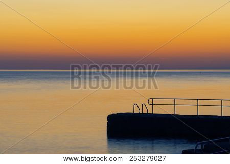 Old Pier On Croatian Coast After Sunset On A Long Exposure