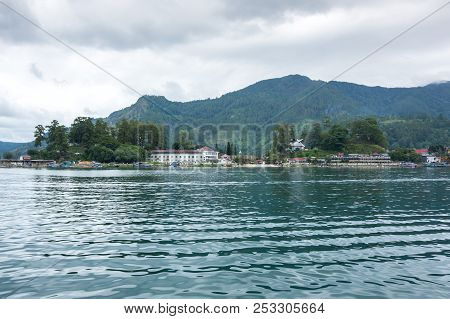Lake Toba Is A Large Natural Lake Occupying The Caldera Of A Supervolcano, Located In The Middle Of 