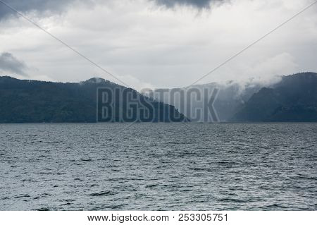 Lake Toba Is A Large Natural Lake Occupying The Caldera Of A Supervolcano, Located In The Middle Of 