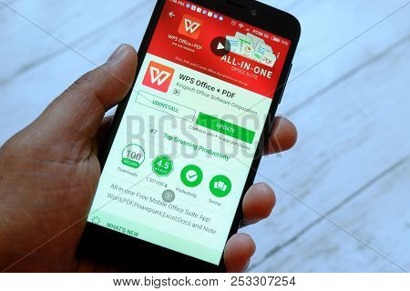 Bandar Seri Begawan,brunei - July 25th,2018 : A Male Hand Holding Smartphone With Wps Office App On 