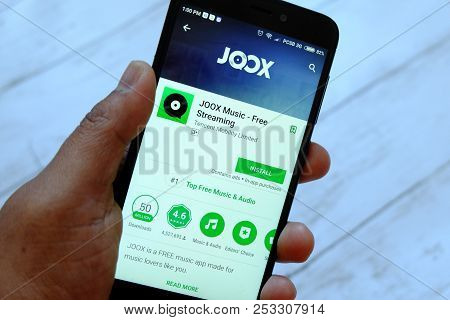 Bandar Seri Begawan,brunei - July 25th,2018 : A Male Hand Holding Smartphone With Joox App On An And